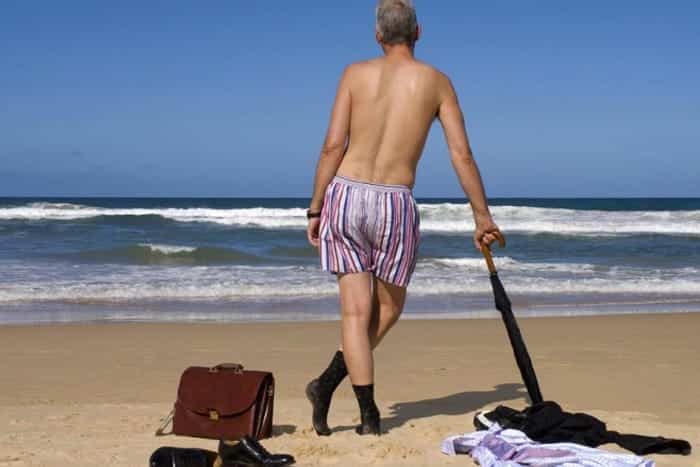 man relaxing on the beach undressed