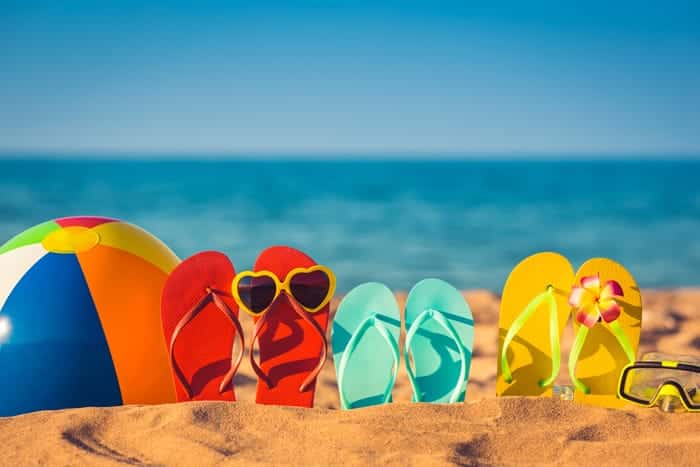 travel insurance beach flip flops